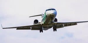 Airplane with landing gear down appears to be coming in for a landing.